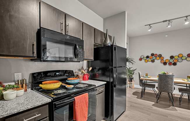 spacious kitchen and dining area at the district flats apartments in lenexa