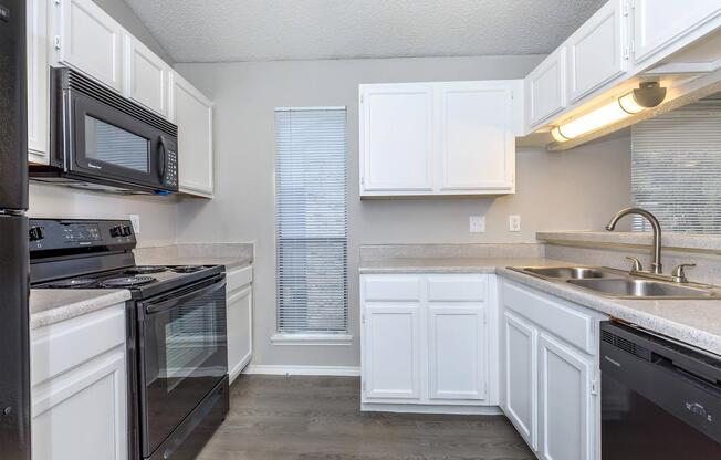 a kitchen with a stove top oven