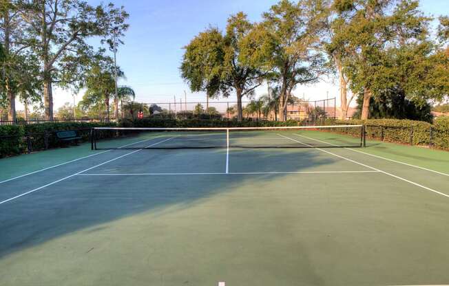Two, hedge lined tennis courts offer a sweet spot for a game.