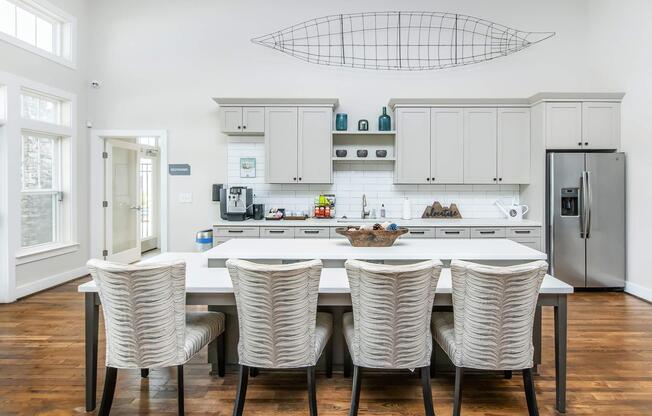 a kitchen with a table and chairs