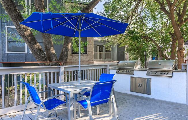 a table topped with a blue umbrella