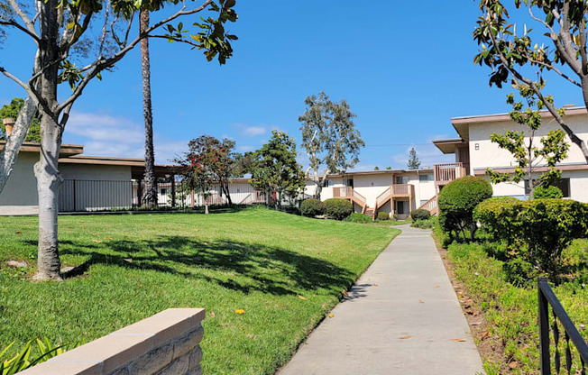 Walkway between apartment buildings at Plaza Verde Apartments in Escondido, California.