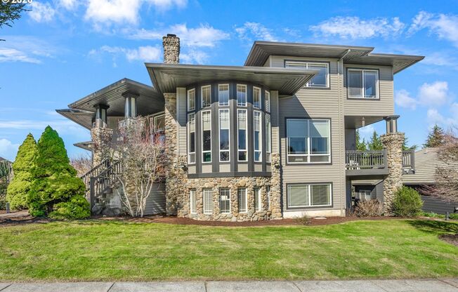 Stunning 5-Bedroom Bull Mountain Estate with Dual Living, Chef's Kitchen & 4-Car Garage