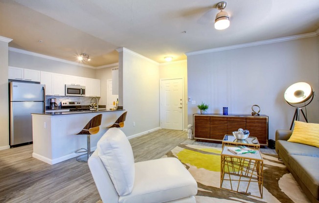 North Phoenix Apartments-Ironhorse at Tramonto Living Room with Wood-Styled Flooring and near the Kitchen Breakfast Bar