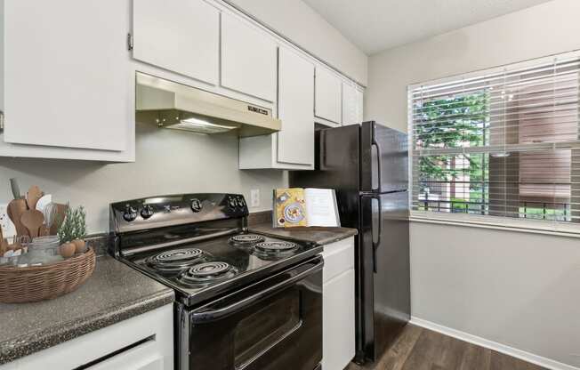 our apartments offer a modern kitchen with stainless steel appliances at Acacia Gardens, Albuquerque, NM, 87111