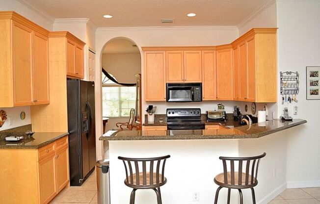 Well maintained large 4/2/2 corner lot pool home on a canal