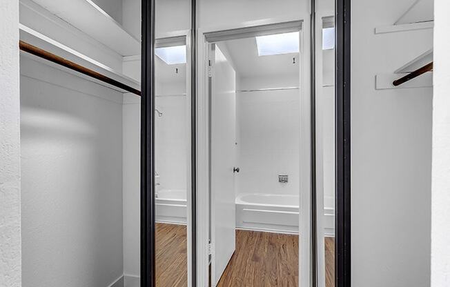 a bathroom with a toilet and a bathtub