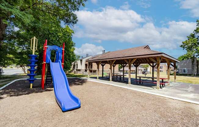 Playground with shaded pavilion at  Woodbridge Apartments