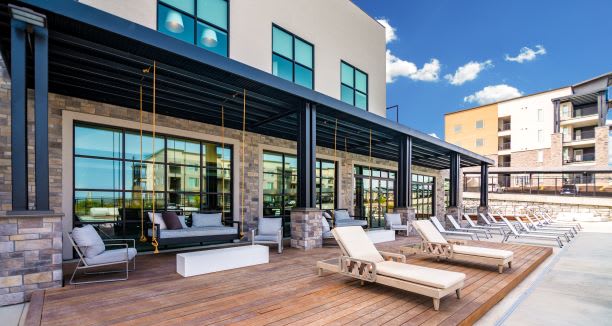 Lounging By The Pool at Soleil Lofts Apartments, Herriman, UT