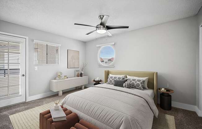 Model Bedroom with Carpet and Patio Accessibility at Stillwater Apartments located in Glendale, AZ.