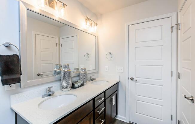 a kitchen with a sink and a mirror