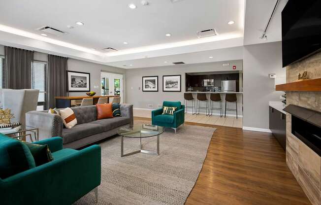 A living room with a green couch and a coffee table.
