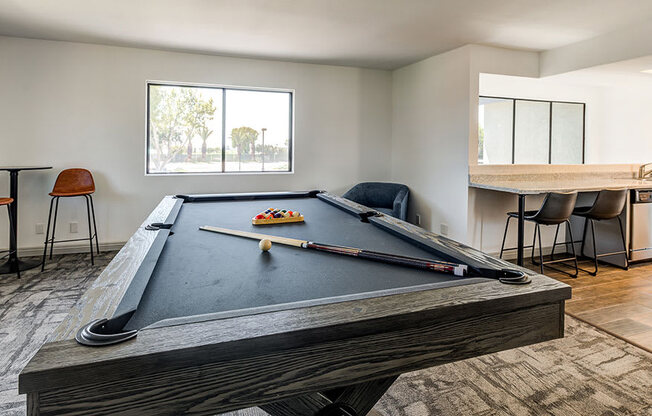 1 BR Apartments in Ontario, CA - Clubhouse Game Room with a Pool Table and Lounge Seating