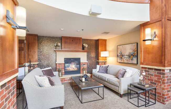 a living room with couches and a fireplace