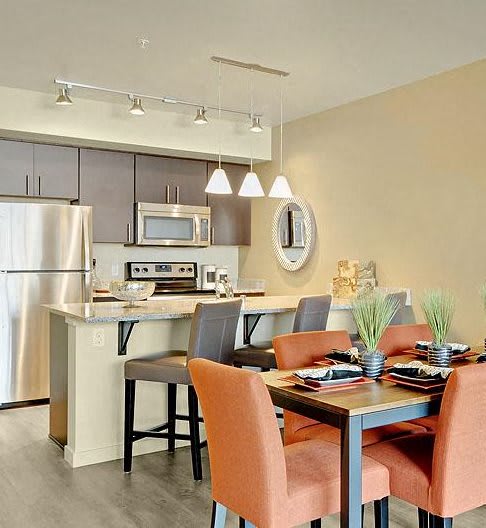 A kitchen with a table and chairs. at Kirkland Crossing Apartments, Washington