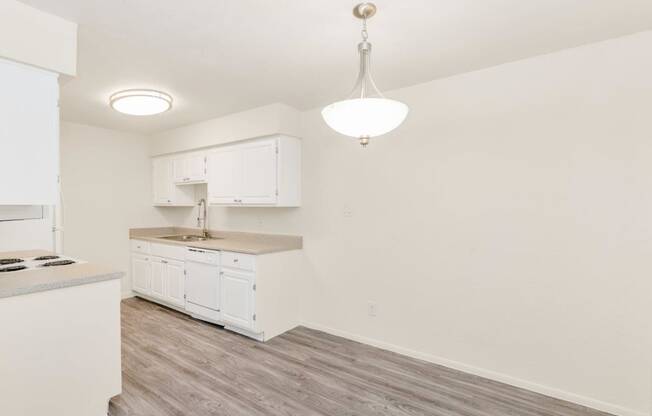 a kitchen and dining area in a 555 waverly unit