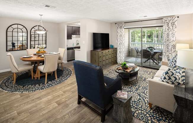 A living room with a dining table and chairs.