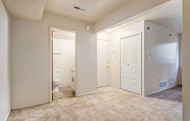 a bedroom with a toilet and a closet