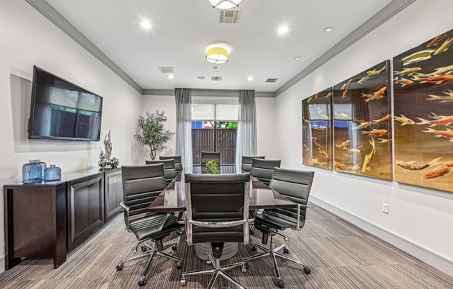 Private conference room with a large table and modern decor at Allusion at West University apartments in Houston, TX