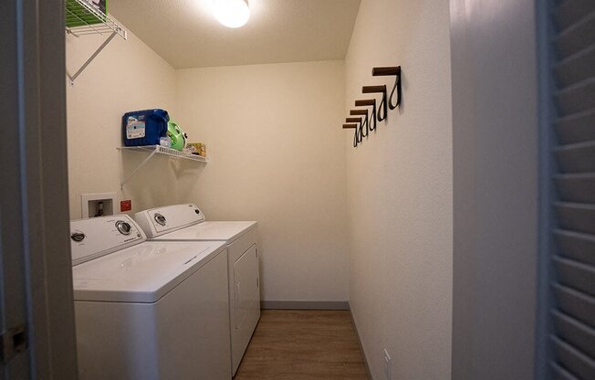 a laundry room with a washer and dryer in it