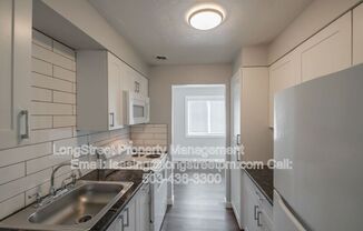 208 5 AVE SE