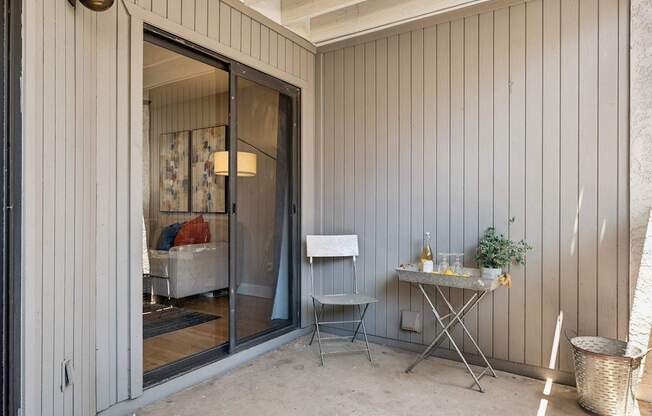 A patio with a table and chairs is shown.
