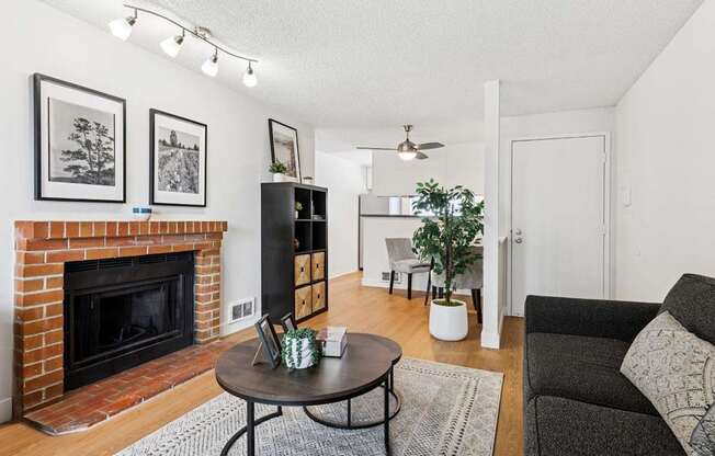 A living room with a fireplace and a couch.