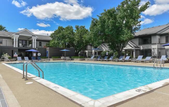 our apartments have a large pool with chairs and umbrellas