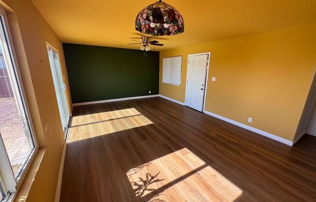 Colorful bungalow style home with plenty of yard.