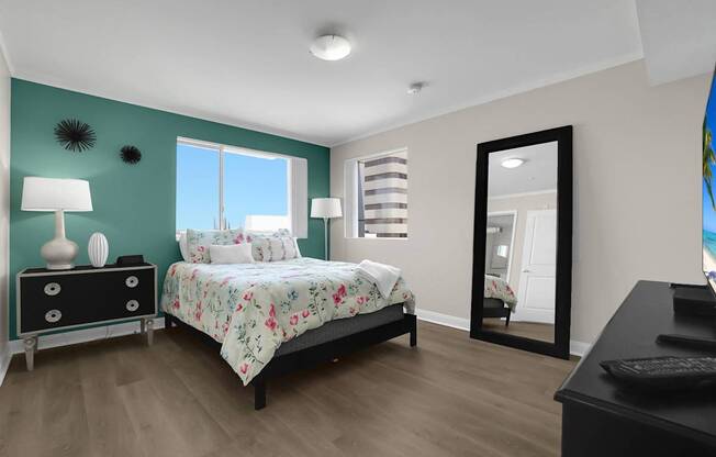 A bedroom with a bed, dresser, and mirror.