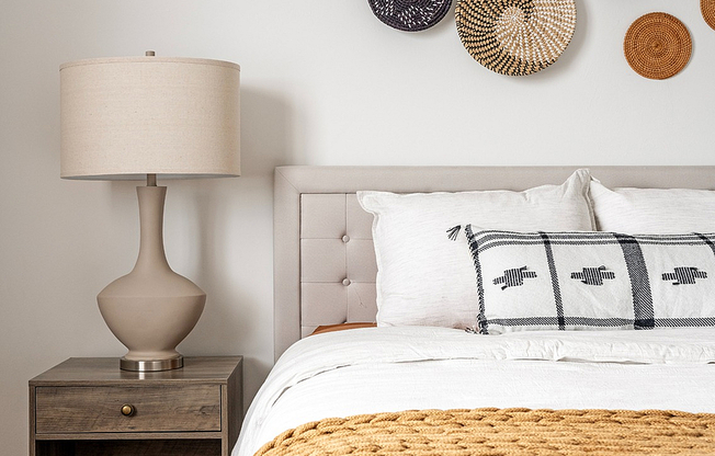 Experience warmth and elegance in this thoughtfully designed bedroom.