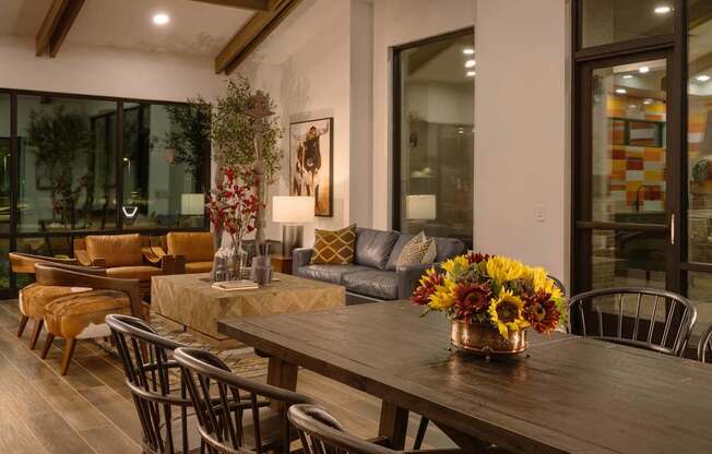a dining room with a wooden table and chairs at Weylyn Luxury Apartments, Arizona