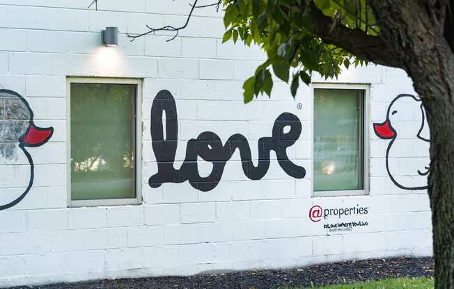 a mural on the side of a white building