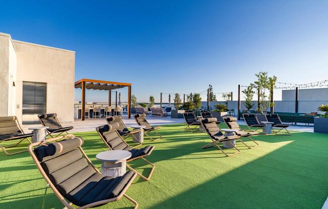 Soak up the sun and stunning views at Modera Pomona's rooftop oasis! With ample seating and a relaxed atmosphere, it's the ideal spot to unwind, entertain, and enjoy the beauty of California.