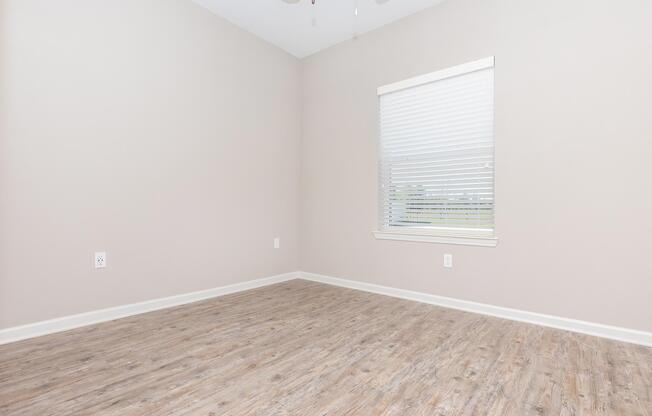 a bedroom with a large window