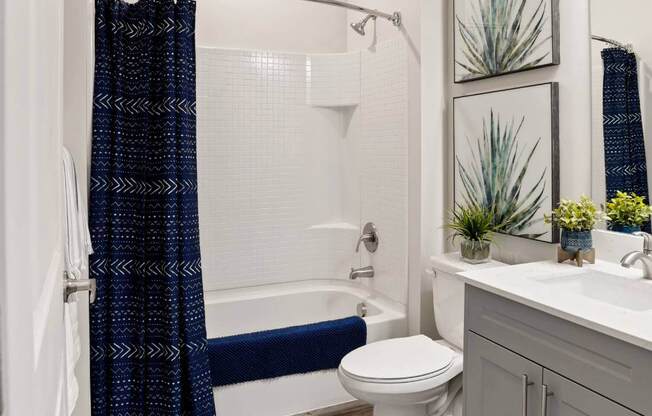a bathroom with a shower and a toilet and a sink at 200 City View, Provo, UT