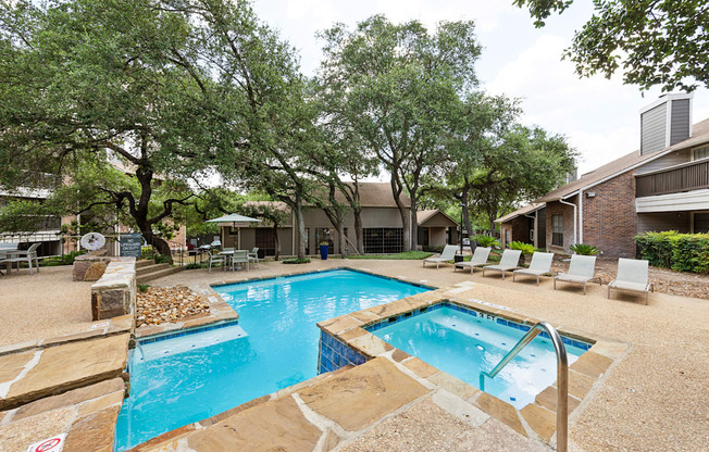 our apartments have a swimming pool and a patio with chairs