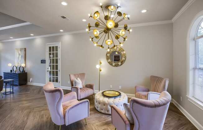 a living room filled with furniture and a large chandelier