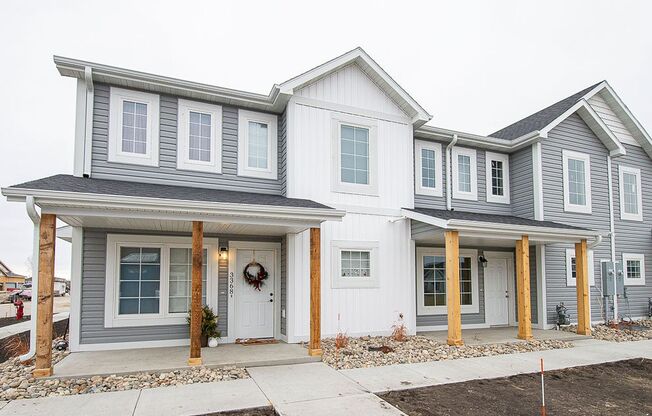 Stylish Luxury Townhome Featuring a Large Green Space in a Carefree Living Community!