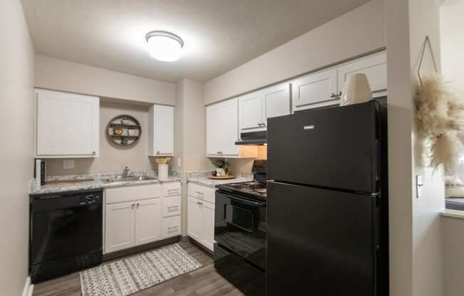 This is picture of the kitchen in the 823 square foot 2 bedroom apartment at Aspen Village Apartments in the Westwood neighborhood of Cincinnati, OH.