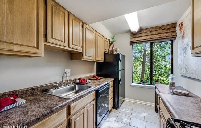 Updated Kitchen With Black Appliances at Brookland Ridge Apartments, Washington