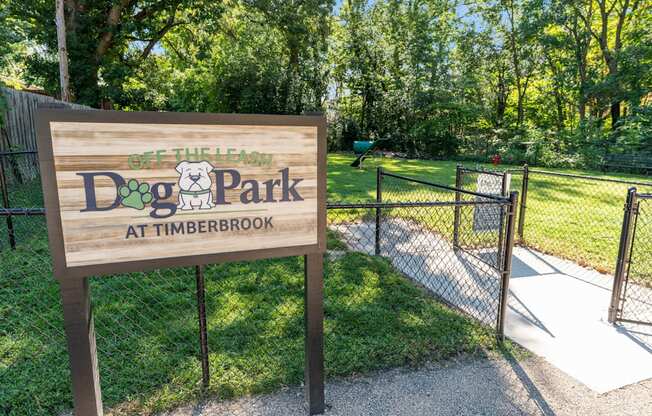 A sign for Dog Park at Timberbrook is shown.