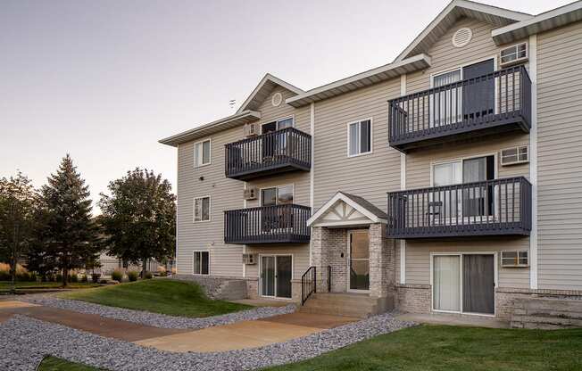 Private patios overlooking walkable spaces outside the property