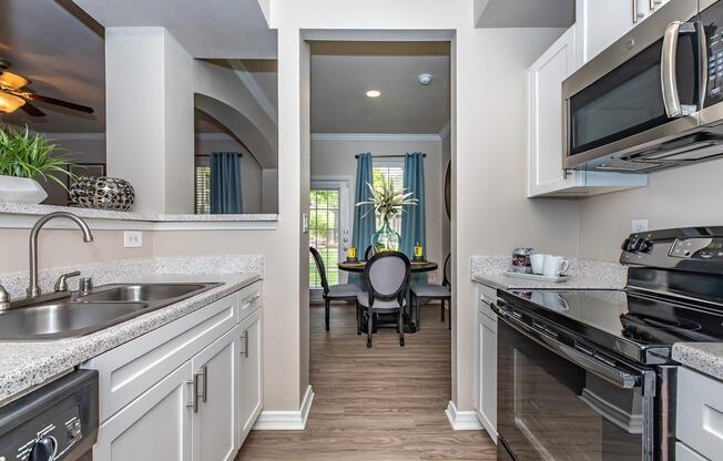 a kitchen with a sink and a window