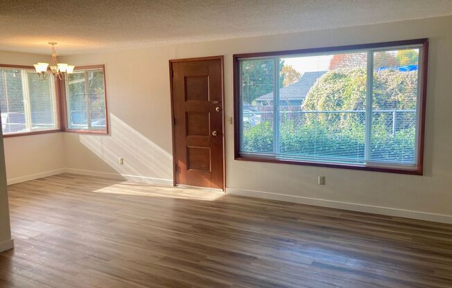 *$500 OFF FIRST FULL MONTH'S RENT* Charming 2-Bed, 1-Bath Remodeled Duplex with Brand New Flooring, Fireplace, A/C, and Water/Sewer Included – Prime Milwaukie Location!