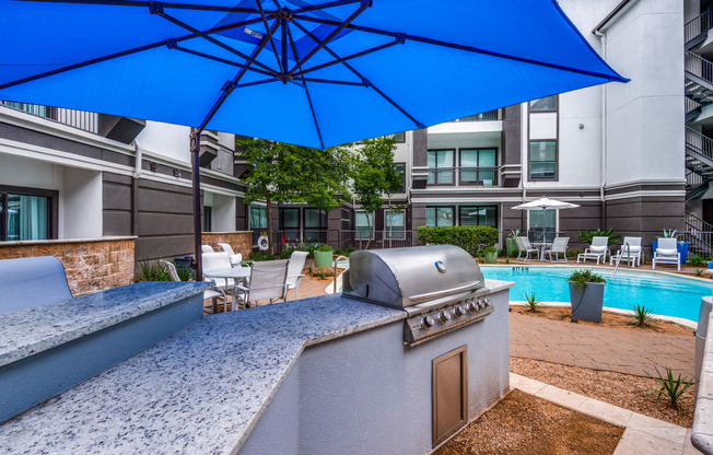 our apartments have a pool and a bar with a grill