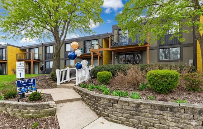 A building with a sign that says "OFFICE" in front of it.