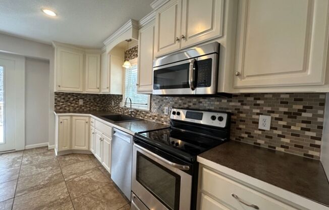 {10240}  Renovated Home in Cherry Hills+ Hardwoods Throughout + Finished Basement + Fenced Yard!