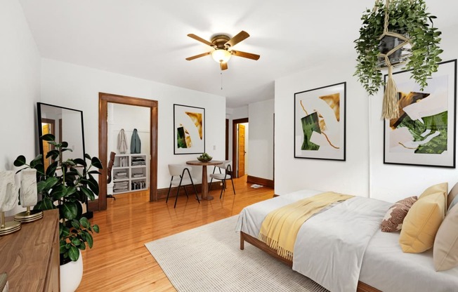 a bedroom with a bed and a ceiling fan