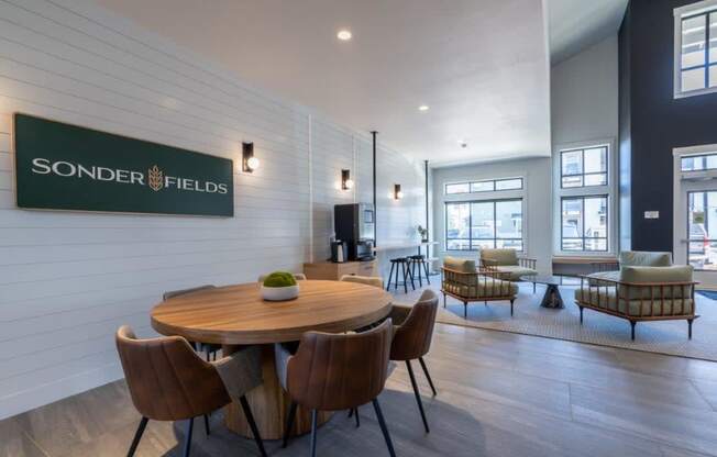 a dining room with a wooden table and chairs at Sonder Fields in Happy Valley, OR